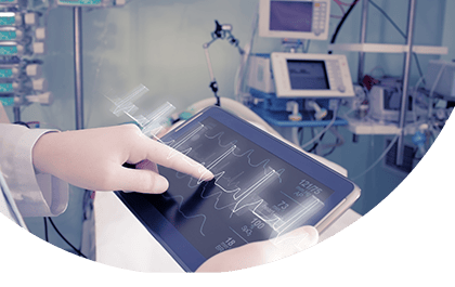 healthcare professionals hand using data on tablet to aid diagnostic